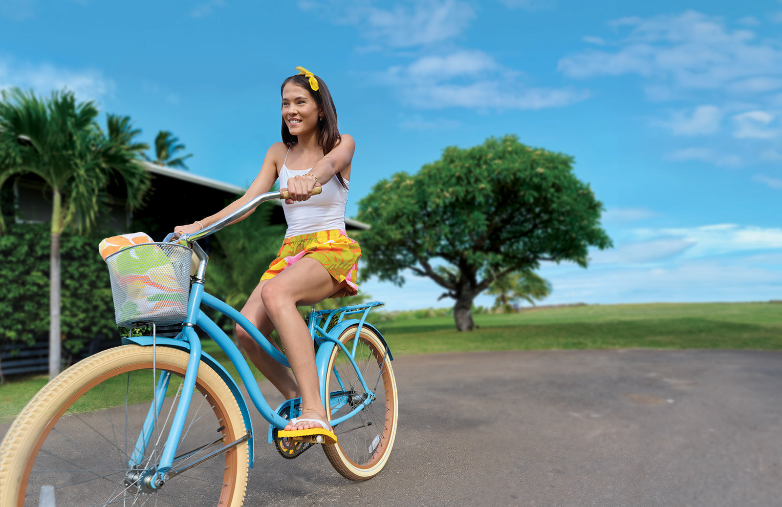 Girl on a bike wearing Locals slippahs