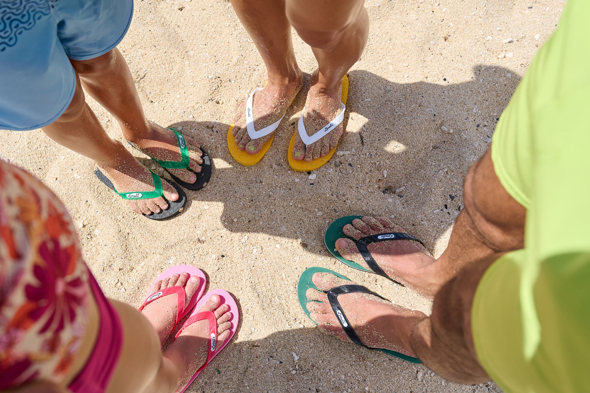 Group shot of people wearing Locals slippahs